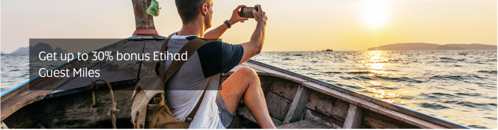 a man taking a picture of a boat